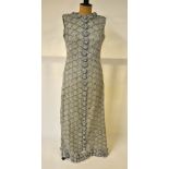 A silver crocheted evening dress embellished with blue and pearl beads, lined with grey silk,