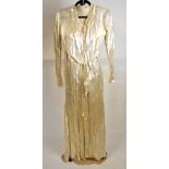 A 1930s cream silk satin wedding dress with inset panels and small train, with silk underslip, 47 cm