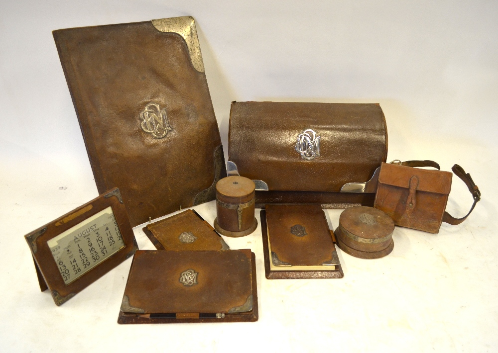 An Asprey of London silver-mounted leather desk set, comprising stationery box, A3-size blotter