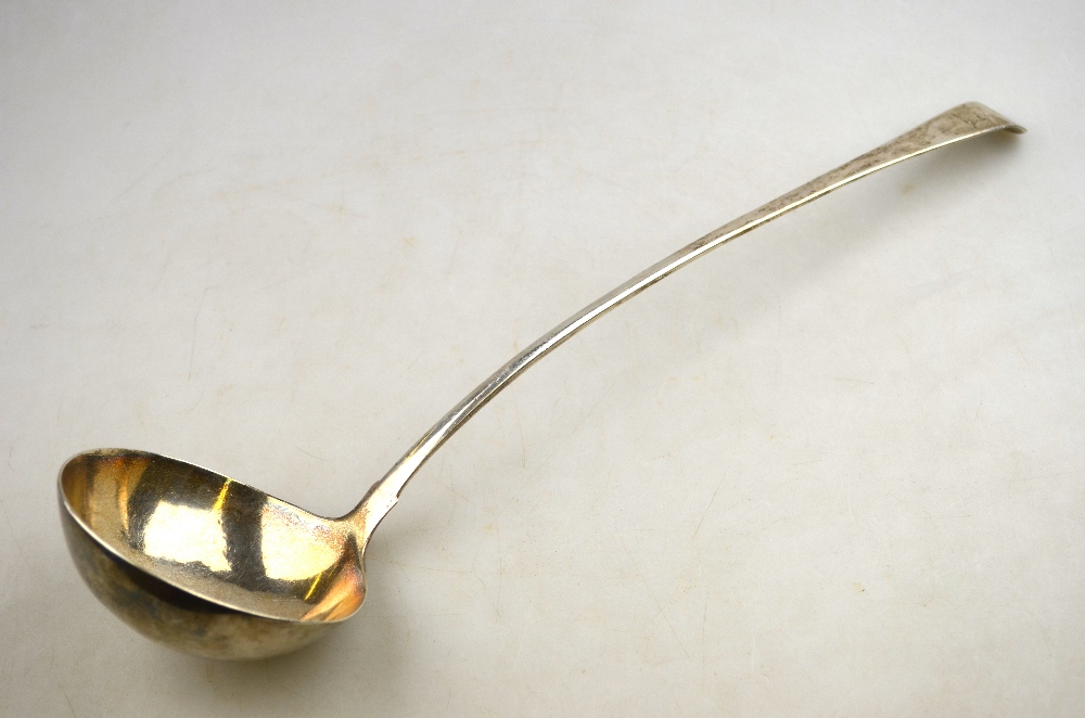 An 18th century OEP silver soup ladle with slender stem, maker's mark rubbed,