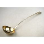 An 18th century OEP silver soup ladle with slender stem, maker's mark rubbed,