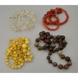 A collection of natural bead necklaces including ivory, cornelian,