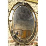 A 19th century giltwood and gesso framed oval mirror with mirror border - a/f,