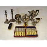 An epns half-reeded four-piece tea/coffee service, a pair of plated on copper candlesticks,