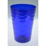 A large 'Bristol blue' tapering glass vase, moulded with swagged decoration, 31 cm high Condition