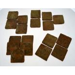 A collection of eighteen mediaeval (by repute) terracotta floor tiles with slipware decoration