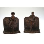 A pair of Austrian patinated bronze book-ends,