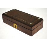 An early 19th century rosewood box with red silk fitted lining,