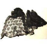 A collection of early 20th century black needle-run and other lace flounces,