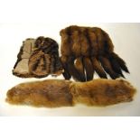 A musquash fur muff with tail embellishments, a fox fur evening cape,