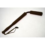 A two-piece turned wood truncheon with leather-bound spring 'hinge' and ribbed grip,