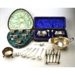A cased set of six Victorian silver small open salts with spiral reeding and ball feet,