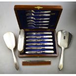 An Art Deco style engine-turned four-piece brush set including hand-mirror and comb, Mappin & Webb,