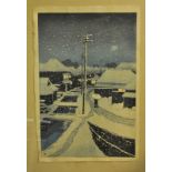 Hasui Kawase (1883-1957), a signed woodblock print, snowy suburban view, 36 x 24 cm,
