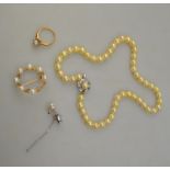 A single row uniform cultured pearl necklace to/w cultured pearl circlet brooch (one pearl missing),