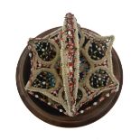 A Victorian glass bead basket with bead doily beneath,