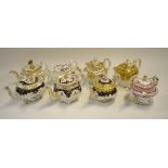 A collection of eight 19th century Staffordshire teapots and covers including five Ridgway