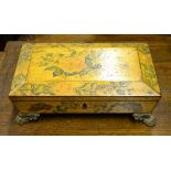 A Regency sarcophagus form polychrome decorated table casket raised on case brass feet,