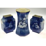 A Royal Doulton Burslem garniture set of three vases, each decorated with little girls seated