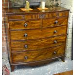 A Victorian figured mahogany chest of two frieze over two short and three long graduated drawers