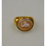 An ancient-style agate cameo ring of cherub riding a dolphin in hollow yellow gold setting Condition