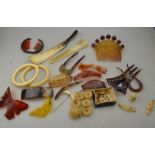 A collection of horn, tortoiseshell and other items including coronet style hair comb,