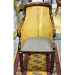 A Regency style bergere library armchair