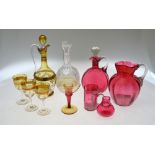 A cranberry glass decanter and stopper,