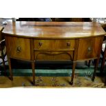 A mahogany bowfront sideboard with centr