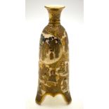 A Japanese Satsuma bottle vase on three splayed legs decorated with shaped cartouche of Immortals,