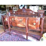 A substantial Regency mahogany stage-back bowfront serving sideboard,