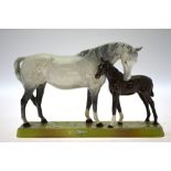 A Beswick group, mare and foal, raised on a rectangular base, no.