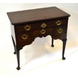 A George III mahogany lowboy, the moulded edge top over a arrangement of four frieze drawers,