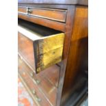 A George III mahogany chest of four long graduated drawers with ivory escutcheons,