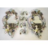 A pair of Sitzendorf oval porcelain girandole mirrors,