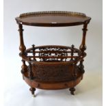 A Victorian boxwood inlaid burr-walnut two tier Canterbury of oval form,