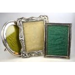 An Edwardian Art Nouveau-embossed silver photograph frame, Birmingham 1906, to/w an oval frame,