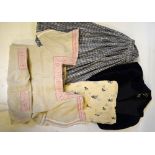 A box of mixed vintage clothing to include a black crepe skirt, embroidered lawn shawl,