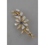 A freshwater pearl and sapphire spray brooch,