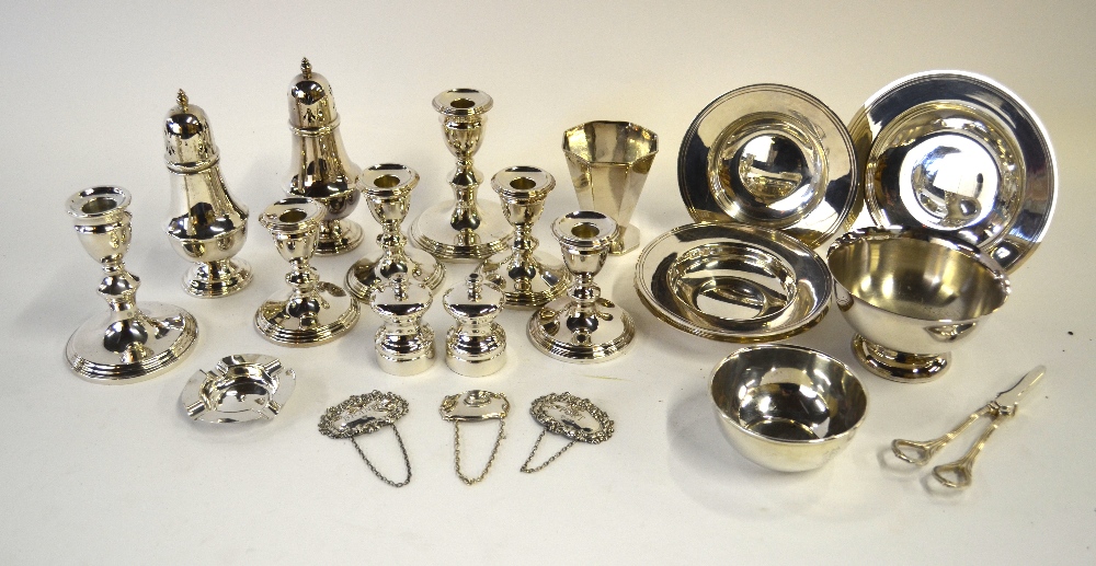 A quantity of electroplated table wares, including three pairs of candlesticks,