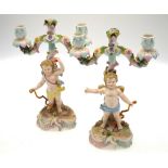 A pair of continental porcelain twin branch candelabra,