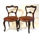 Set of six Victorian carved rosewood side chairs with button upholstery overstuffed serpentine form