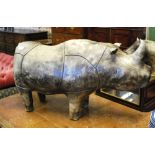 A stitched leather rhinoceros footstool, in the manner of Liberty & Co,