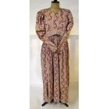 An early 19th century cotton dress with printed stylised floral and foliate sprays on dusky pink