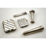 A Victorian diagonal-reeded silver vesta case, Birmingham 1890, to/w an engraved vesta case,