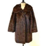 A dark brown French squirrel fur jacket with deep collar, retailed by Bradleys,