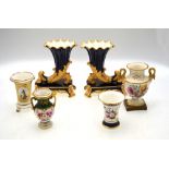 A pair of 19th century cornucopia vases raised on rectangular plinths,