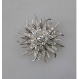 A diamond-set 'sun in splendour' brooch/pendant,