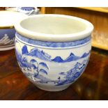 A Chinese blue and white jardiniere decorated with a village scene in a mountain landscape, 23.