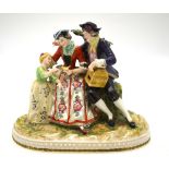 A continental porcelain figural group of a seated couple and young girl with bird and birdcage